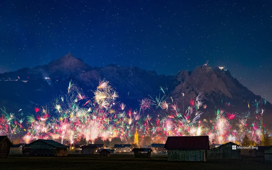 New Year's Eve fireworks over the city of Garmisch-Partenkirchen with a view of the Zugspitze group, Bavaria