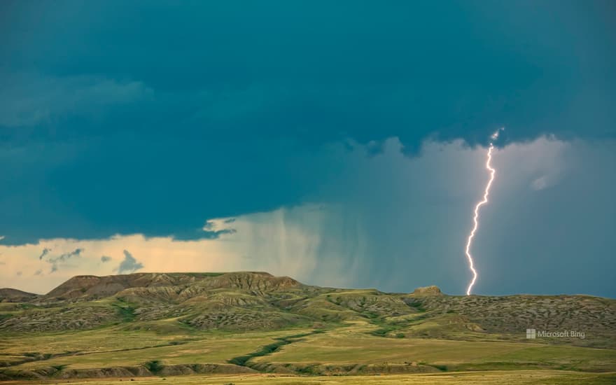 Lightning striking over 70 Mile Butte and Sleeping Lion Butte, Grasslands National Park, Saskatchewan